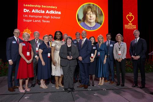 Dr Alicia Adkins receiving award